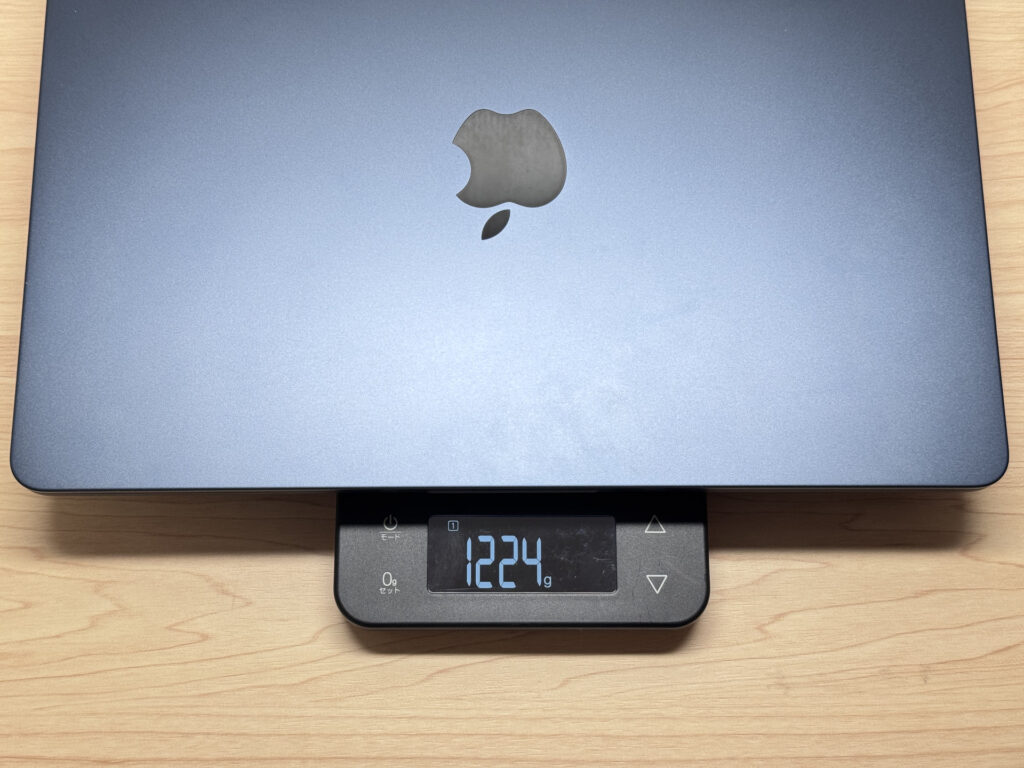 MacBook Air M4 on scale showing 1224g