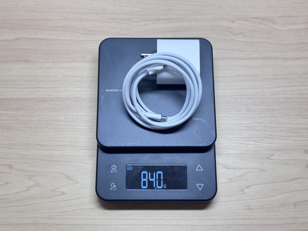 84g (~3 oz) with cable — the lightest stock laptop charger I've seen